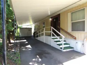 FULL LENGTH CARPORT W/ SHED.