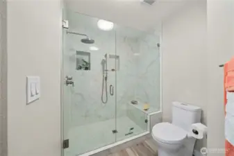 The upstairs bathroom also has a luxury shower with a rain shower head and hand shower.