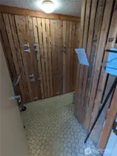 Storage unit off of main building entry