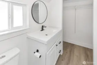 En-suite vanity and walk in closet area.