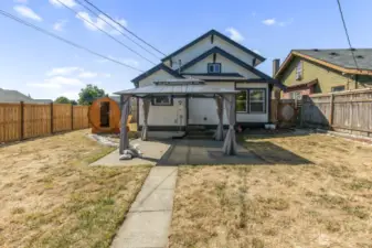 View of back of the home from the detached garage.