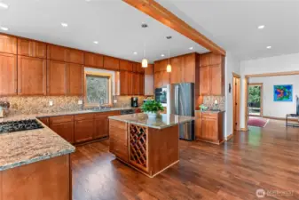 Well designed cooks kitchen with tons of counter space, informal up to the bar seating and plentiful storage.