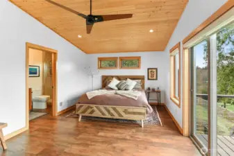 Second ensuite bedroom with .75 bath and deck via the slider.