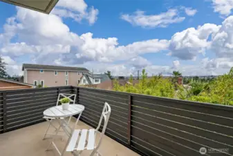 Deck off the main living space with protected views of the Olympics and a peek view of the city.
