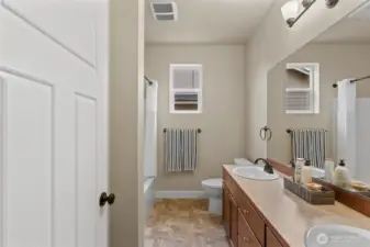 Second bath with double sinks.