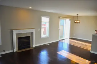 Open living space with plenty of light. Gas fireplace.