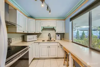 A window in the kitchen invites the outdoors in.