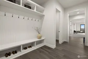 An oversized mud room adjoining the 3 car garage offers a place for daily essentials.