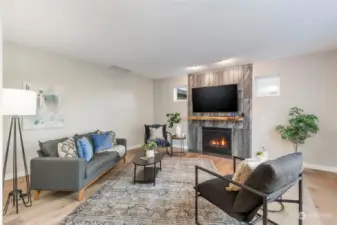 Back living room with cozy gas fireplace. Conduit & power behind the TV for hidden cords.