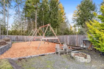 Swing set & firepit area