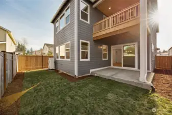 Rear Yard with covered Patio and Covered Private Balcony off Primary