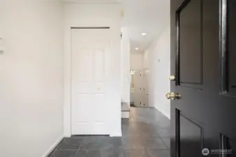 Entry - leads to first floor bedroom, full bathroom & garage + storage!