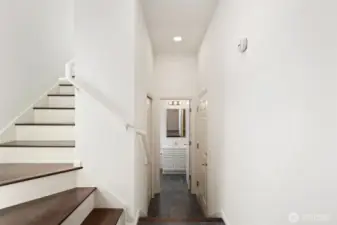 Entry with hallway to first level bathroom and stairs to main living area