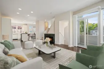 Open Concept, tall ceilings, canned lighting, wood floors and bright with view deck! Virtually staged.