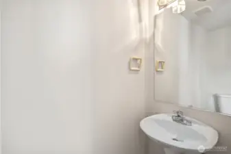 1/2 bath for easy access from living, dining, kitchen areas.