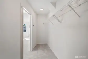 Nice fresh primary bedroom walk in closet - new paint and carpets!
