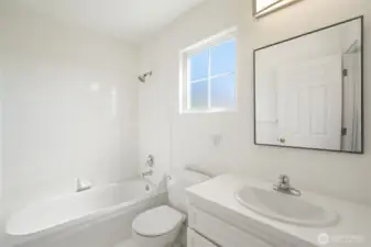 Upper level full bathroom off hallway - new paint & fixtures!