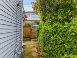 Private entry gate from sidewalk and fenced side yard area