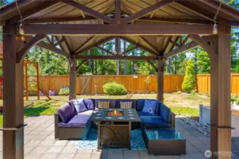 Gazebo with fireplace allows you to enjoy your yard all year round