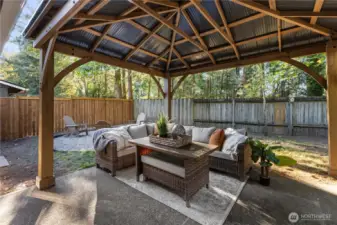 What a fun place to entertain or just enjoy at the end of the day!- This pergola will stay