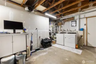 Here is the 1/2 garage- A great space for a workroom, workout space or extra storage.  The garage door fully opens to the space.