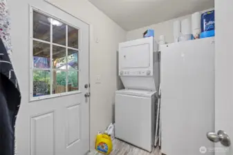 Utility room with door to back deck