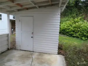 Straight ahead in the carport is the shed.