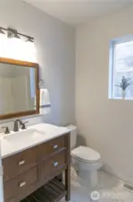 Master ensuite with custom tile floors.