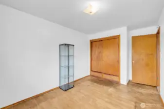 Main level Bedroom 1with closet built in shelves and drawers