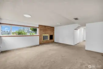 Lower level Family room with wood burning fireplace