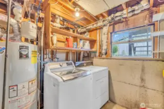 Laundry area with storage and access to outside