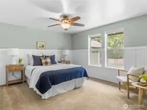 Primary bedroom at the end of the hallway.