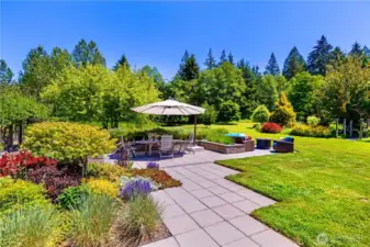 Custom paver patio offers separate, yet connected spaces. Professionally landscaped and installed, low-maintence plant material is deer resistant and drought tolerant.