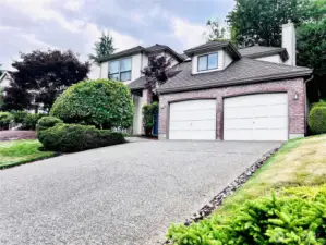 Front view from sidewalk from the north looking westward towards the home.