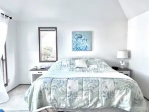 Master bedroom with much light and windows.
