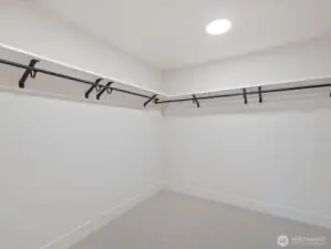 Huge walk in closet in primary bedroom.