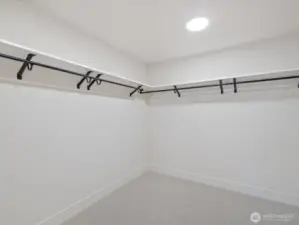 Huge walk in closet in primary bedroom.