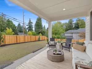 Outdoor, covered living area w/expansive back and side yard. Includes front & backyard irrigation.