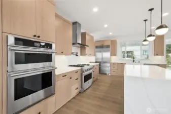 Sub-Zero Refrigerator and JennAir Appliances | Similar home for demonstration purposes only.  Colors and features will vary.  You will choose your interior finishes at our award winning design studio.