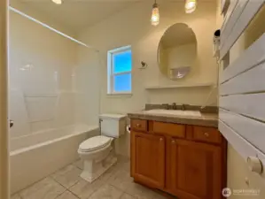 Full guest bathroom on 2nd level off of hallway next to 2nd bedroom. Rental towel heaters in both bathrooms.