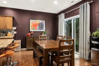 Dining room with slider leading out to the spacious private backyard