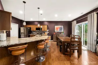 Large kitchen with plenty of cabinet space, pantry and bar area.