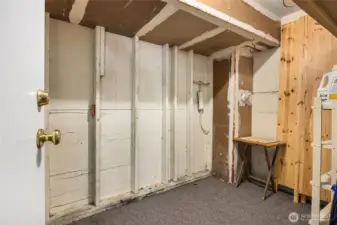 Spacious storage locker is located next to dedicated parking spaces.