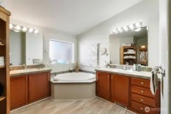 Primary 5 piece bath with corner soaking tub, walkin shower and dual vanities.