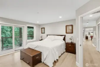 The primary bedroom is on the main level and features direct access to the balcony. The other bedroom on this floor is right across the hall.