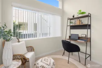 Flexible upper-level room — ideal as a reading nook, home office, or creative studio space flooded with natural light.