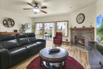 Living Room with Gas Fireplace and slider to fully fenced in back yard and covered patio