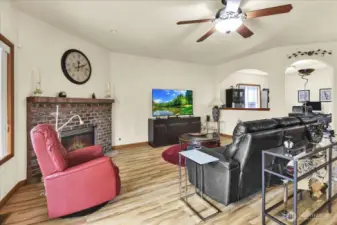 Living Room with Gas Fireplace and slider to fully fenced in back yard and covered patio