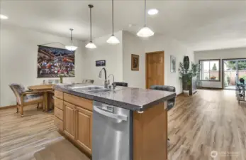 kitchen that boasts New Stainless Steel Appliances, walk in pantry, abundant cabinet storage, tons of counter space, and Large Island with room for bar stools
