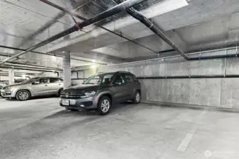 Garage parking space (empty space pictured) is included and no cement poles to navigate on either side!